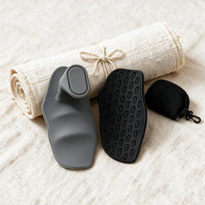 VOZA Kinetic Palm black and graphite pads flat-lay with carry pouch on cream linen
