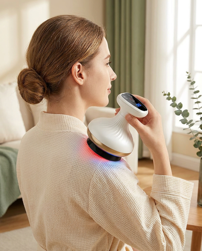 Woman using the VOZA ThermaGlide dome massager on her shoulder